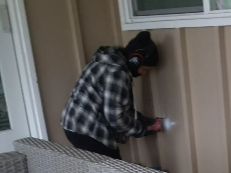 Professional electrician installing an exterior outlet in Chinle