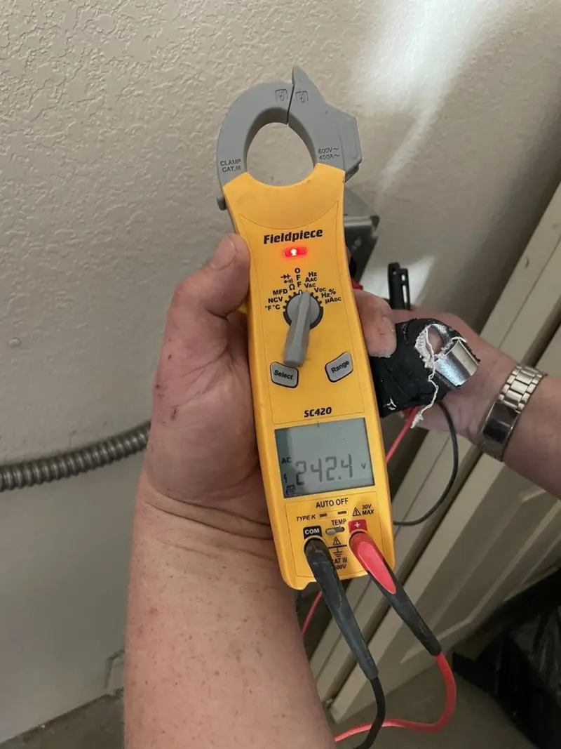 Voltage testing with clamp meter during Hot Tub / Pool Electrical Wiring in Chinle